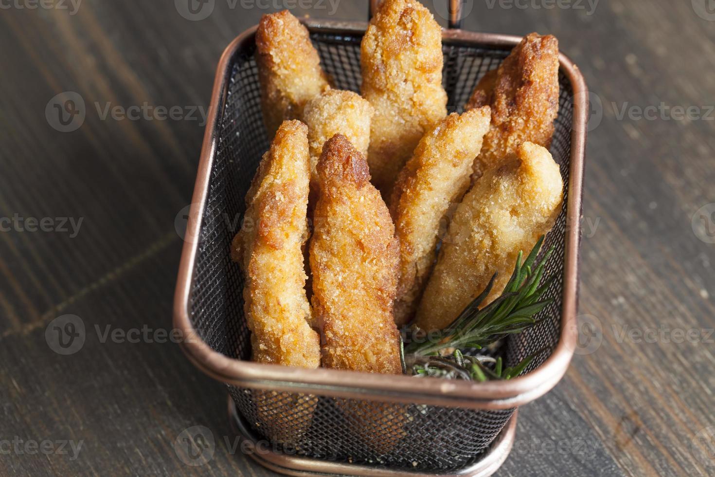 deep fried chicken pieces cut into long pieces photo