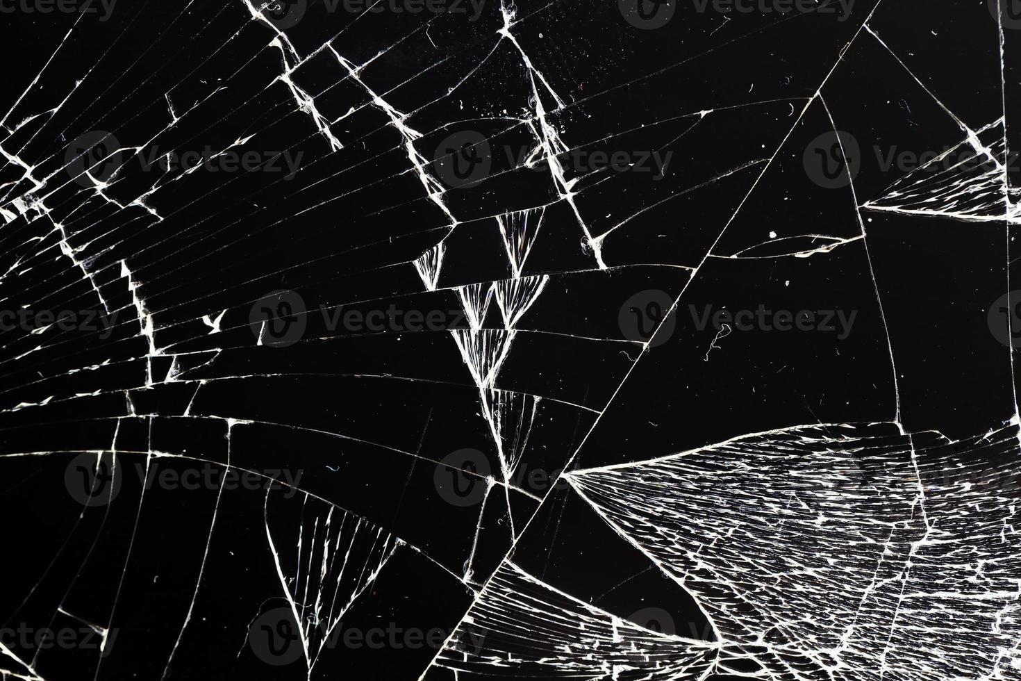 broken thin glass with lots of cracks photo