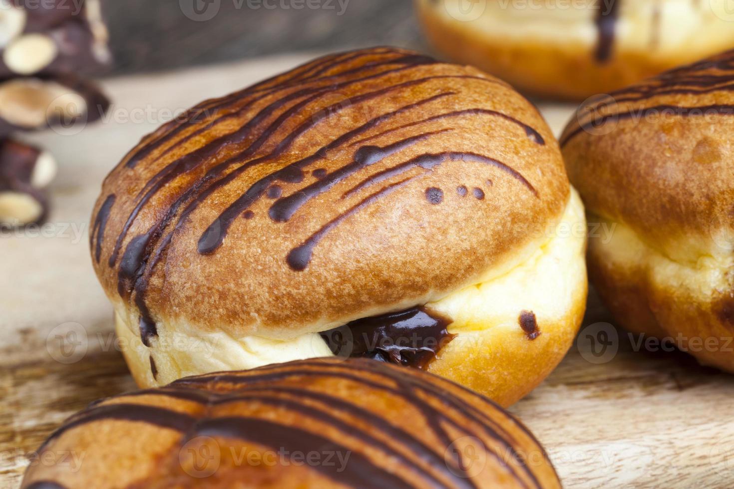 delicious doughnut covered with lines of chocolate photo