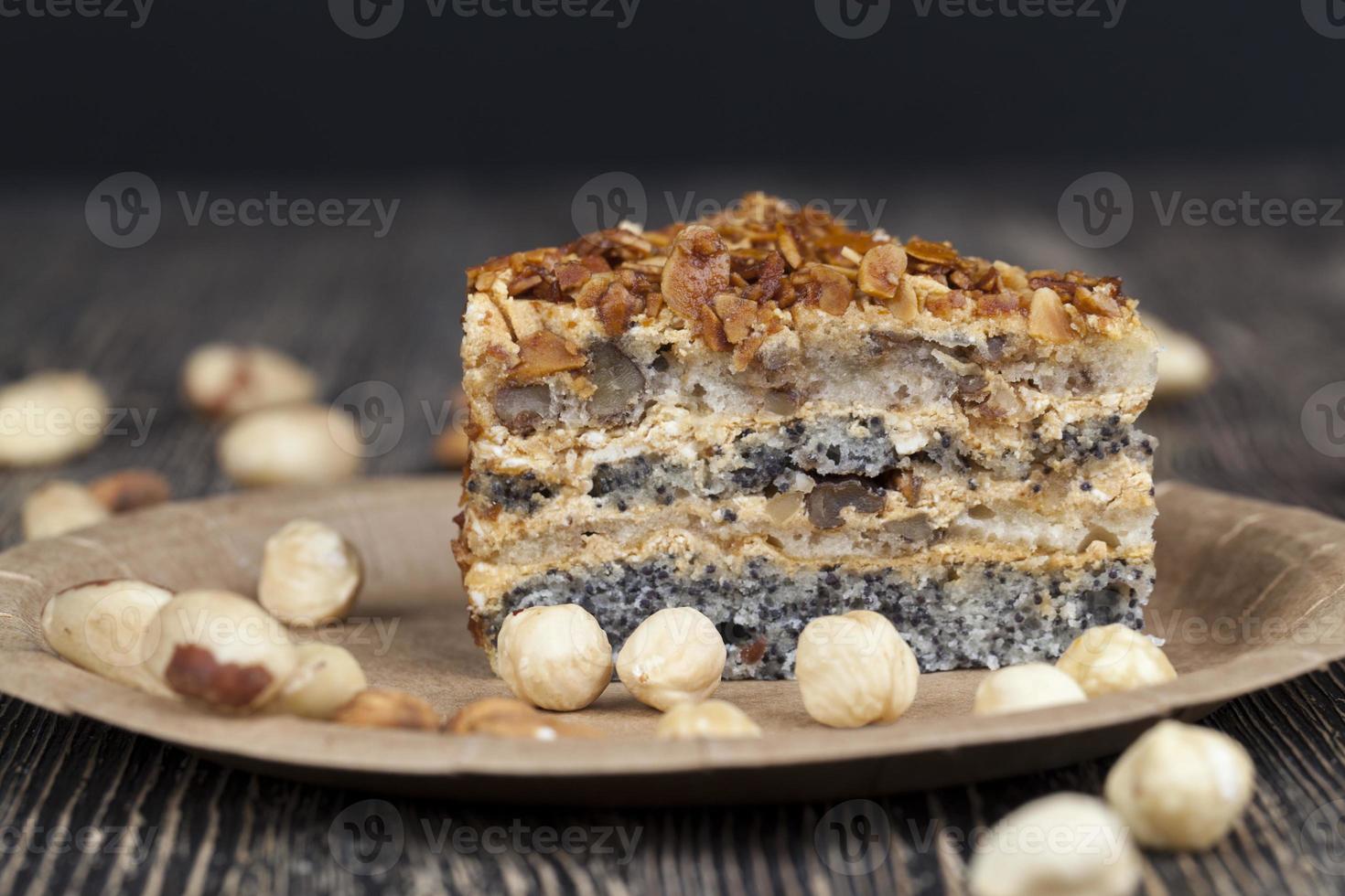 sweet cake with buttercream and sponge cake and lots of poppy seeds and nuts photo