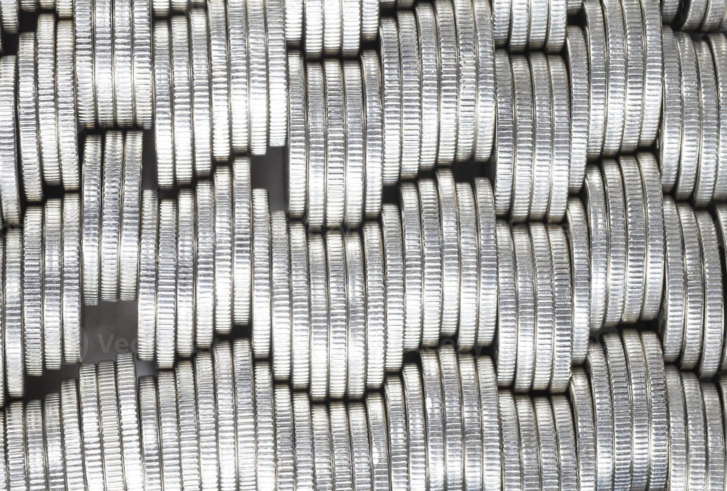 coins of silver color stacked together photo