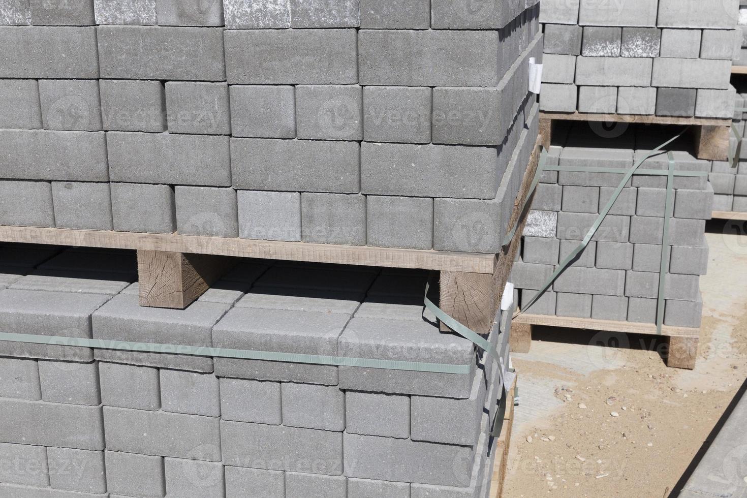 Packed on new wooden pallets, concrete tiles photo