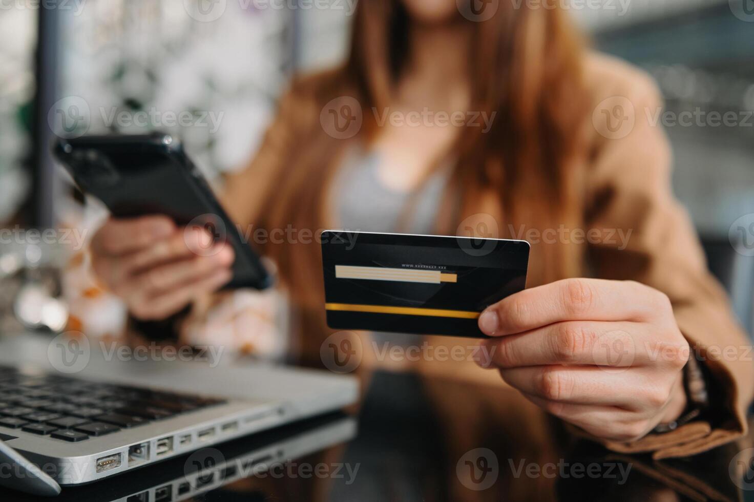 Hand holding credit card and using tablet ,laptop,online banking payment communication network, internet wireless application photo