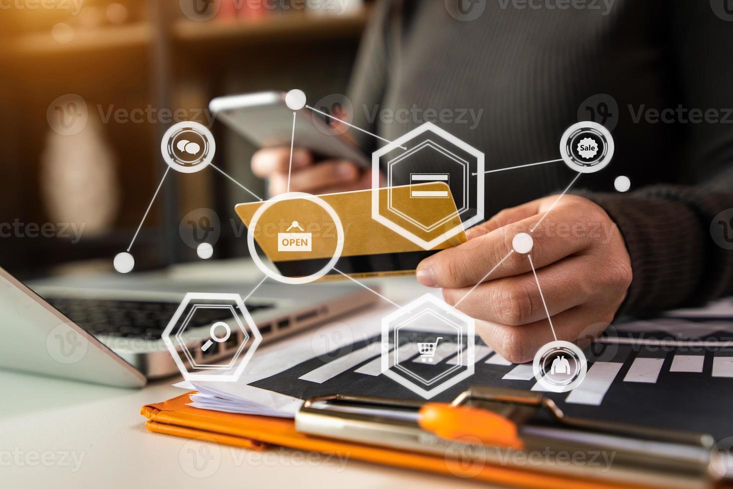 Close up of hand using tablet ,laptop, and holding mobile phone with credit card online banking payment communication network, photo