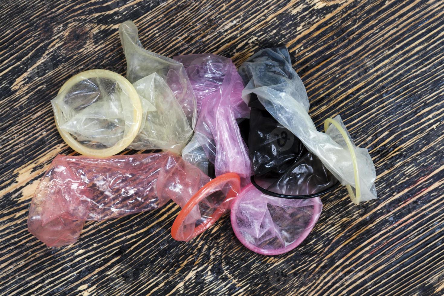 a group of quality latex condoms of different colors photo