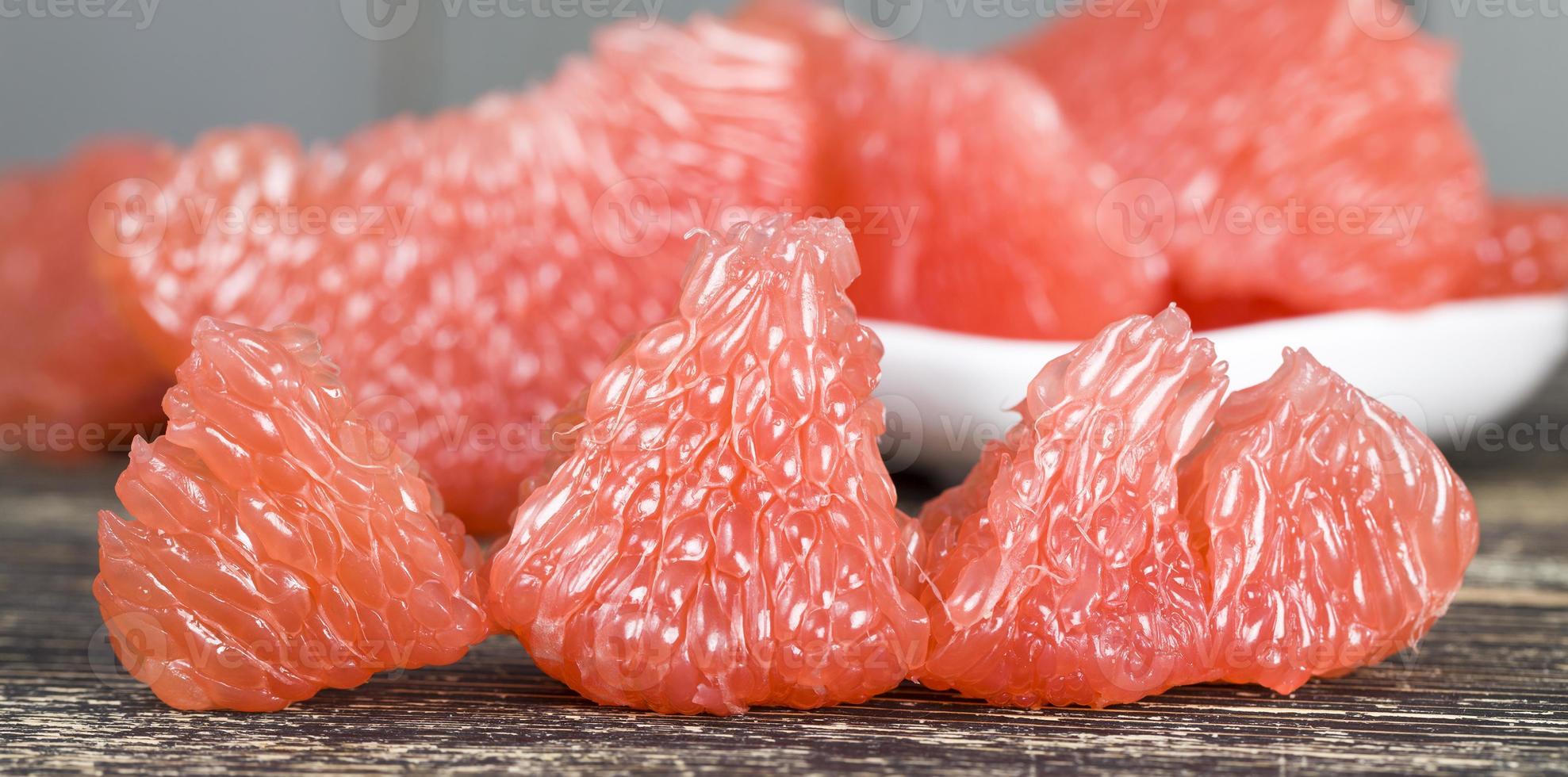 a piece of peeled grapefruit photo