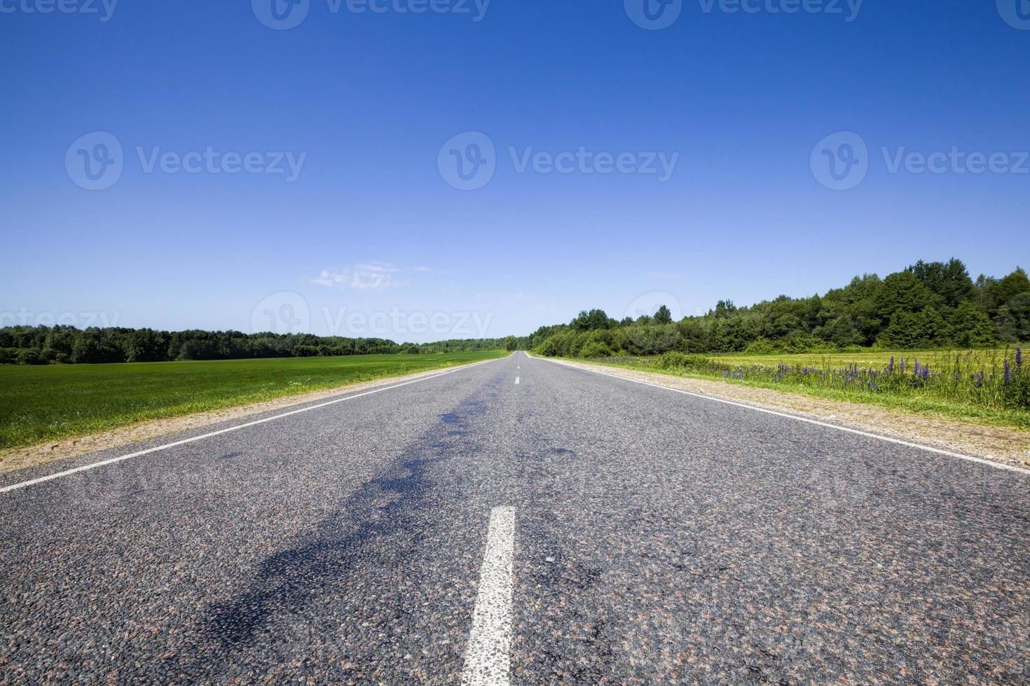 Asphalt road and sky photo