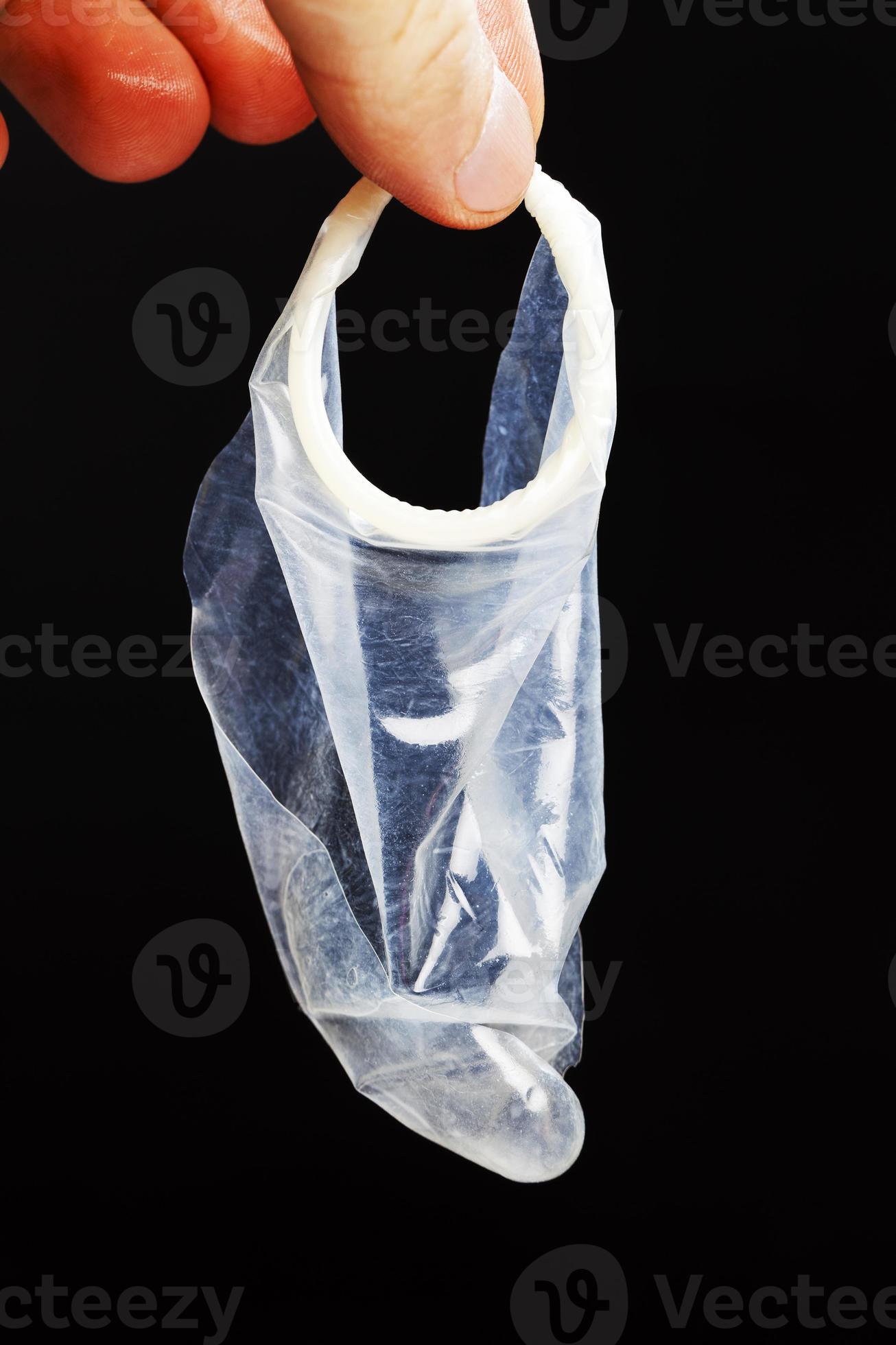 torn white latex condom in hand 9412474 Stock Photo at Vecteezy