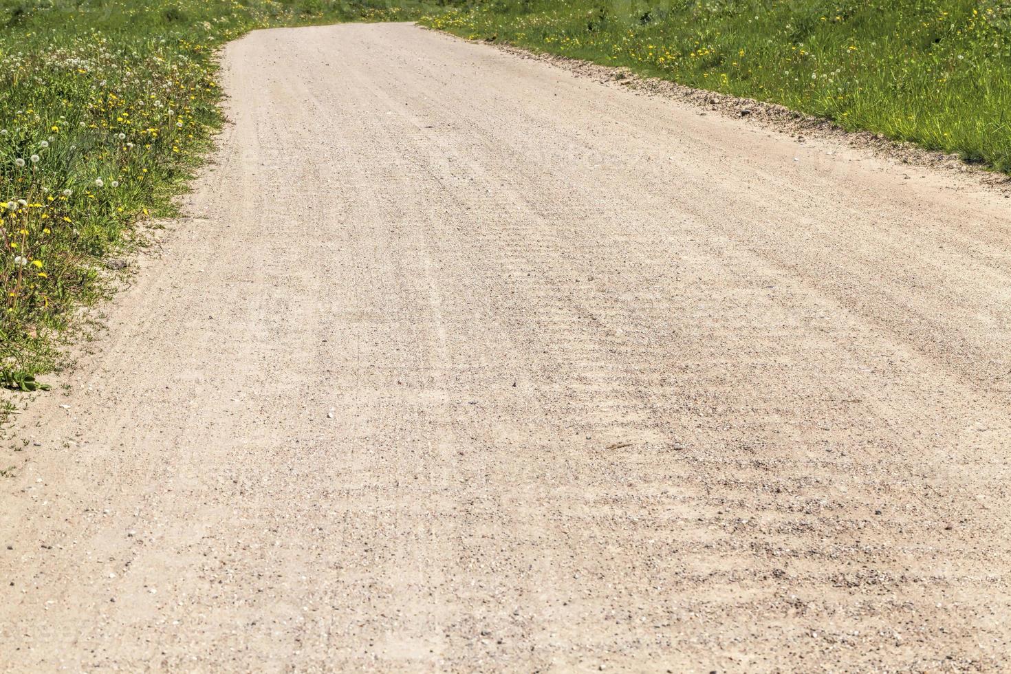 part of a sandy road in the countryside photo