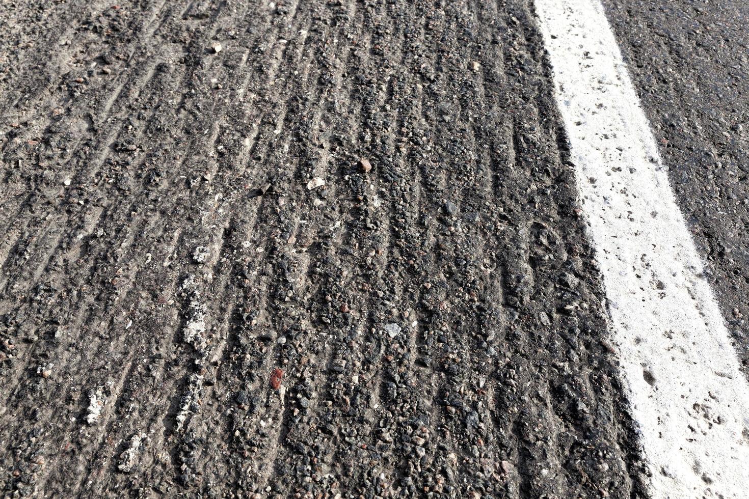 asphalt road that needs repaired photo