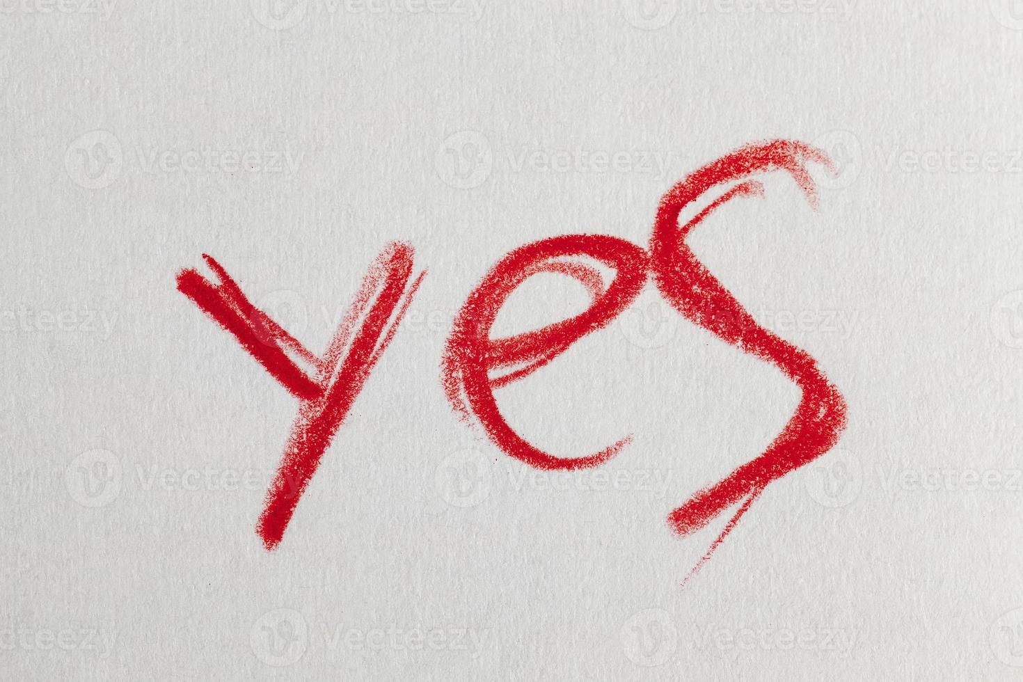word Yes drawn in red pencil photo