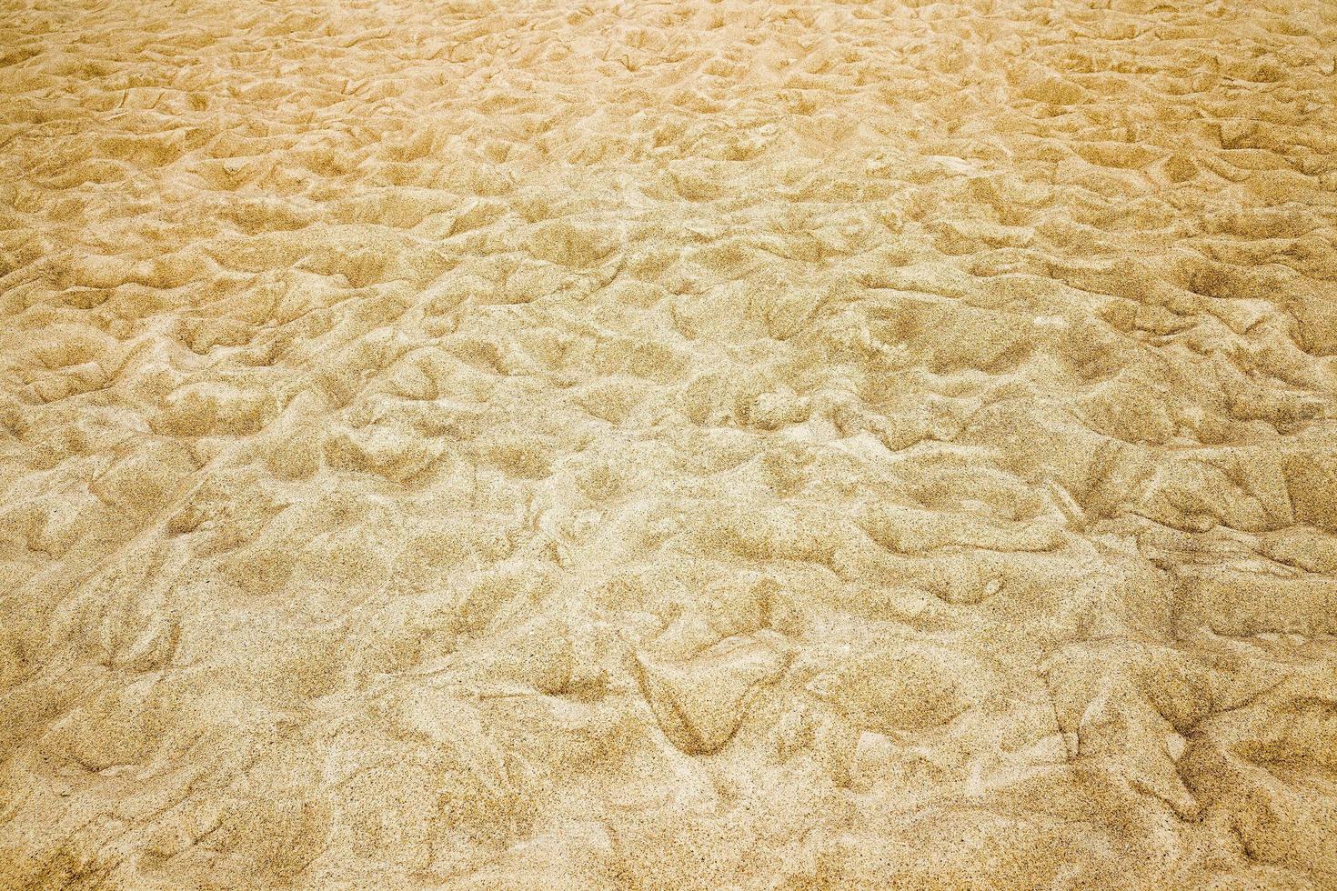 wavy uneven structure of sand photo