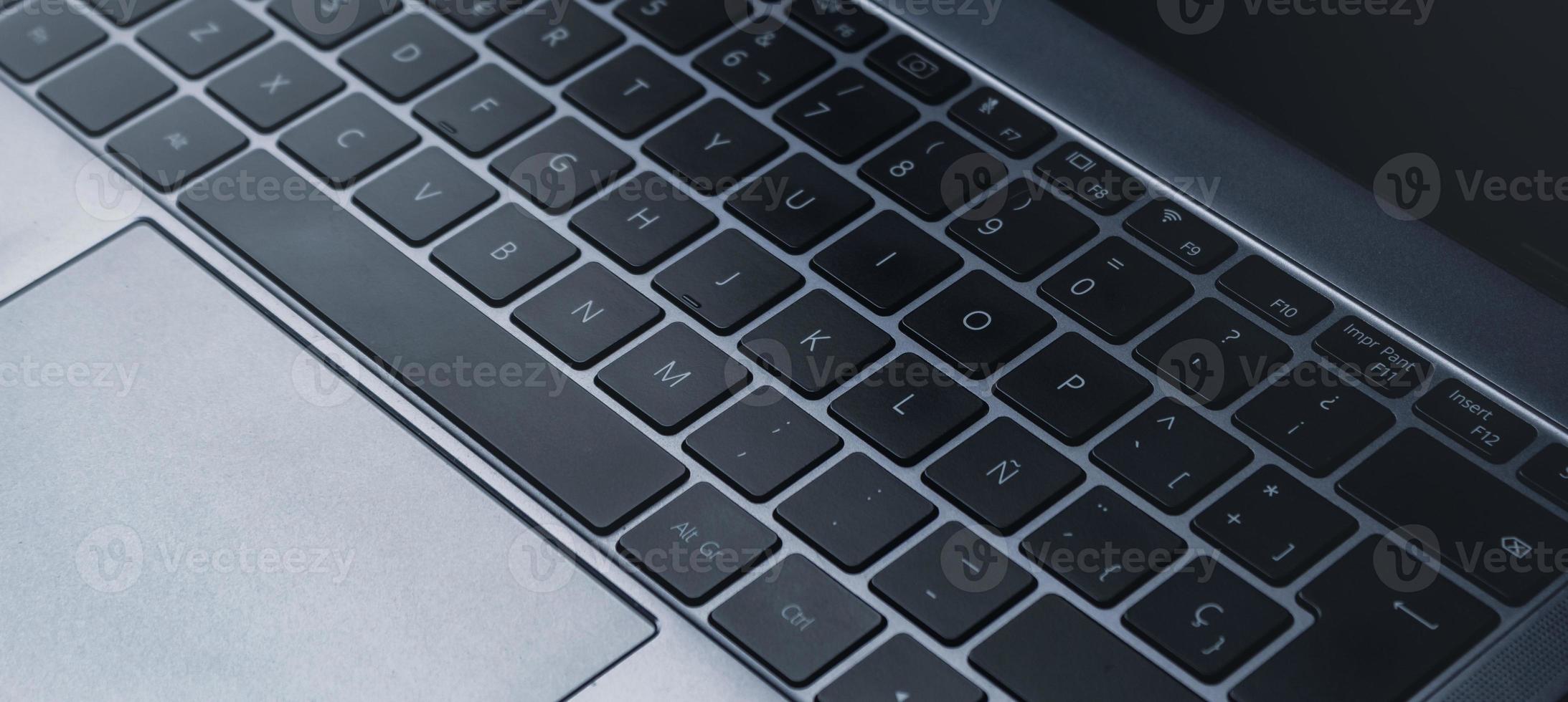Close up of laptop keyboard. Technology concept with copy space. Internet of things. photo