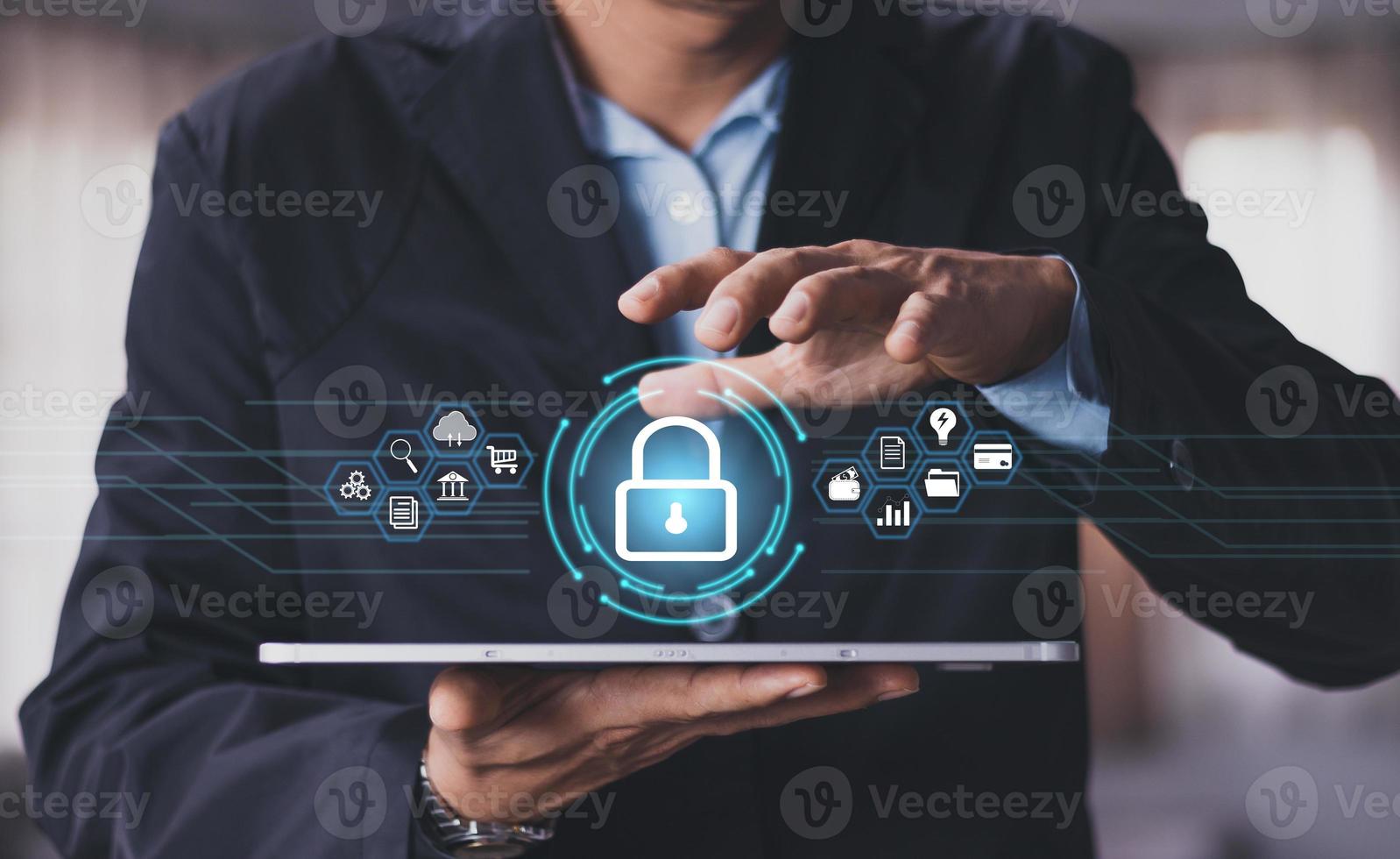 Cybersecurity and privacy concepts to protect data. Lock icon and internet network security technology. Businessman protecting personal data on smart phone with virtual screen interfaces. photo