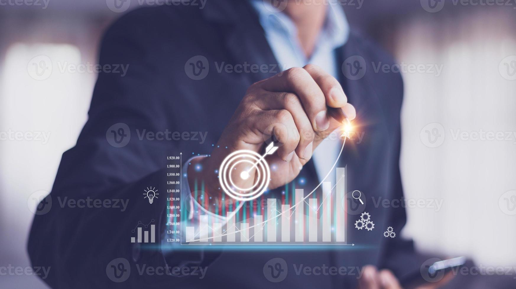 planning and strategy, Stock market, Business growth, progress or success concept. Hand of Businessman or trader touching showing a growing virtual hologram stock on smartphone, invest in trading. photo