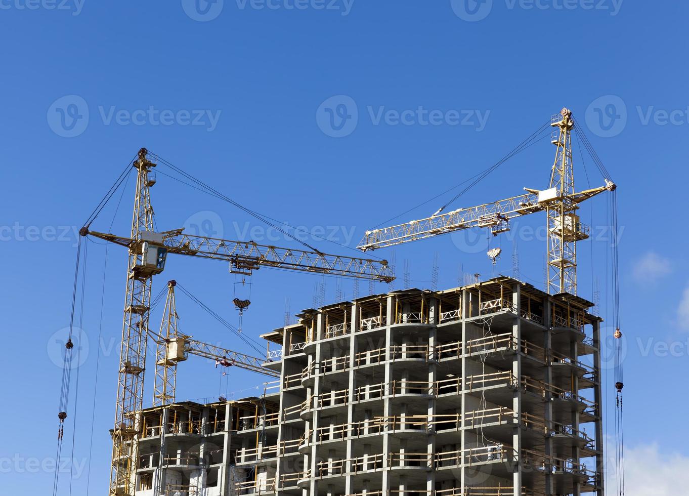 tall yellow construction crane photo