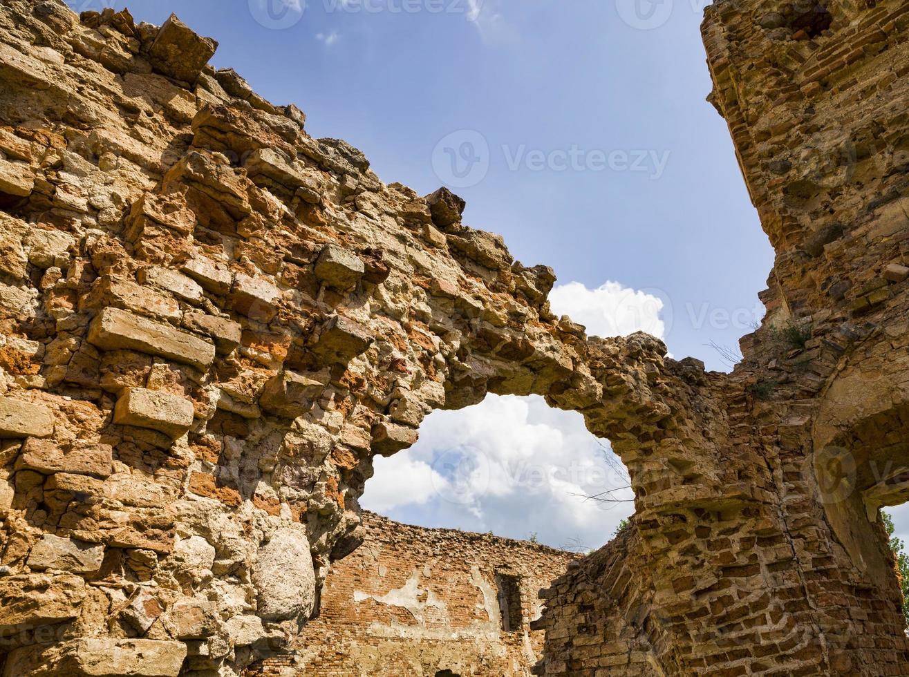 crumbling old brick tower photo