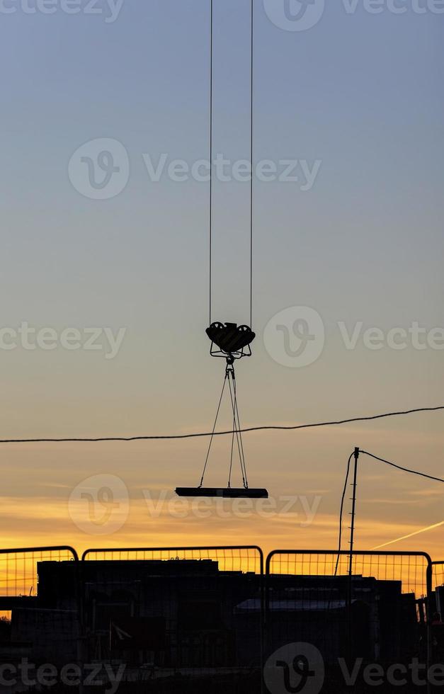 tall yellow construction crane photo