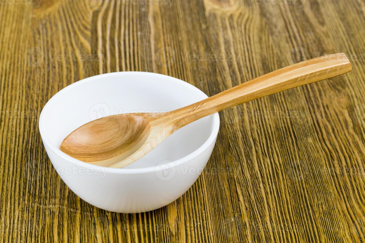 wooden spoon in a bowl photo