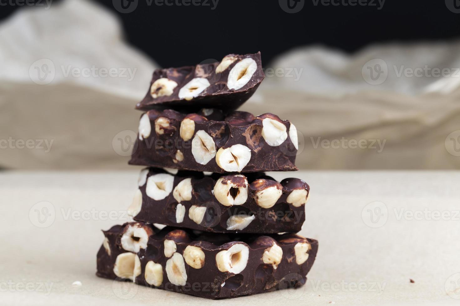 nuts and natural products in the production of chocolate with nuts photo