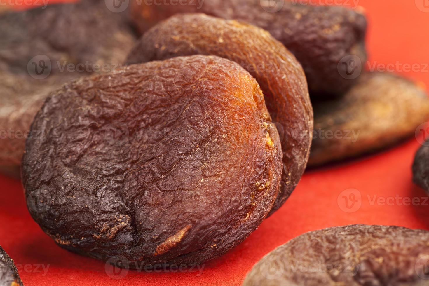 dark dried apricots of large size 9430021 Stock Photo at Vecteezy