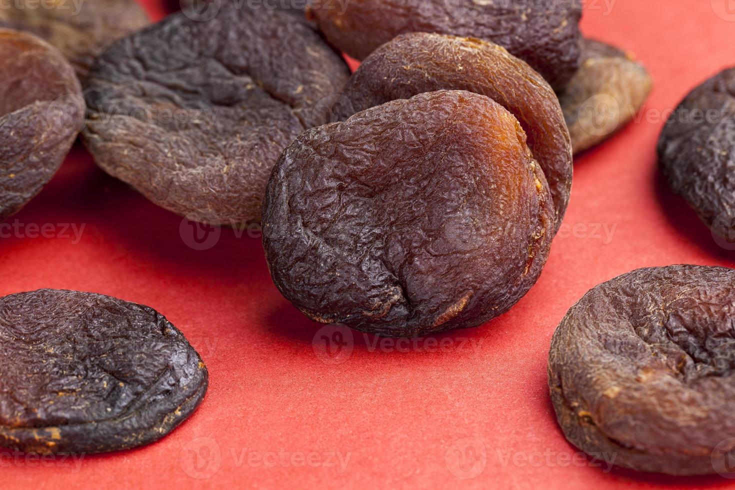 dark dried apricots of large size 9430175 Stock Photo at Vecteezy