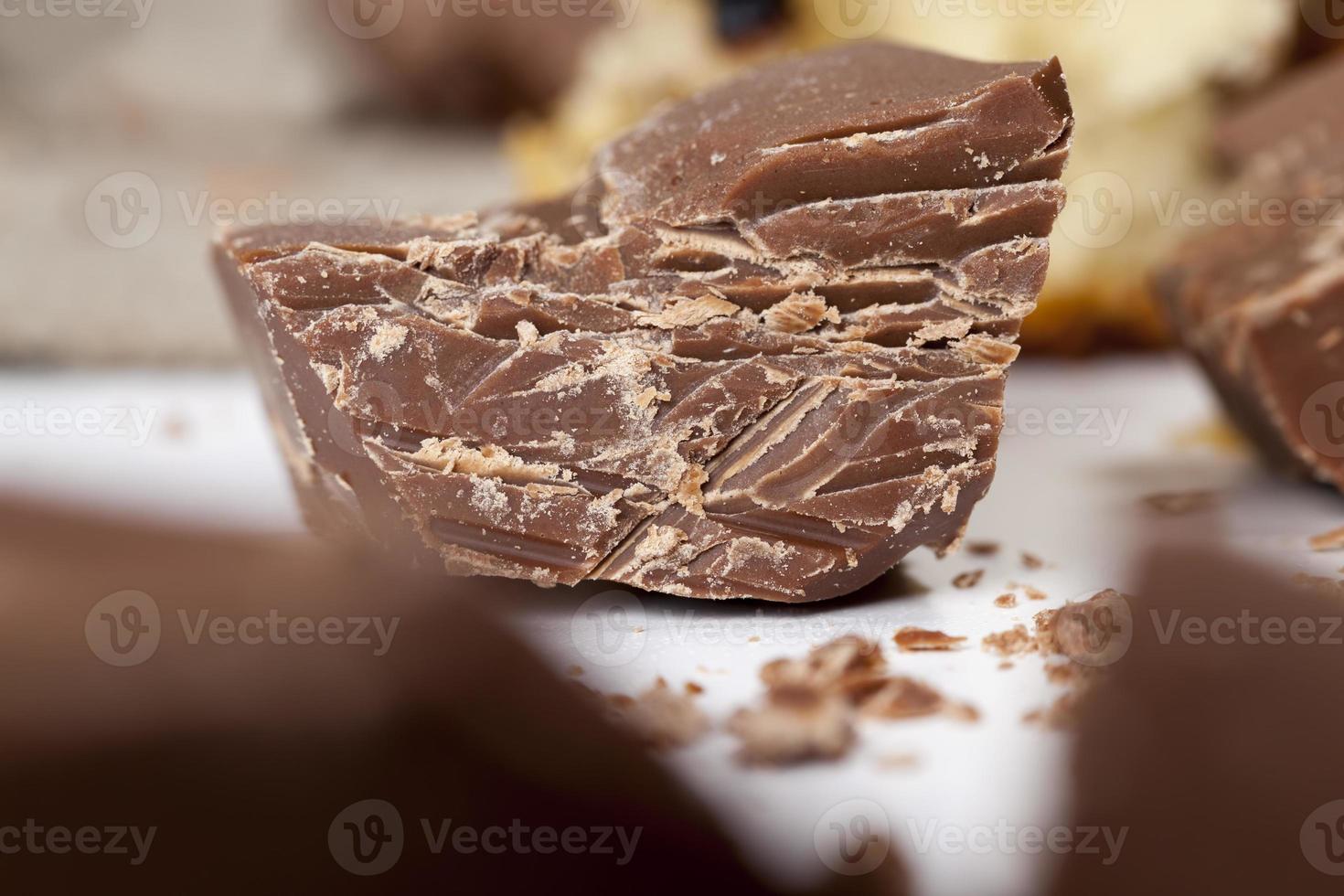 divided into pieces a piece of chocolate from cocoa photo