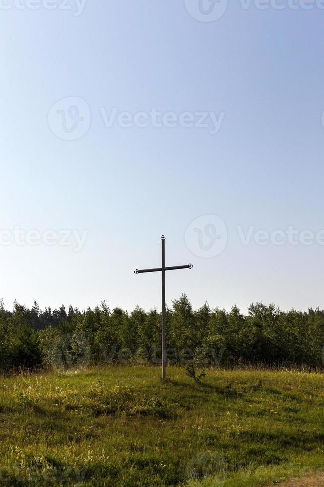 rusty metal cross photo