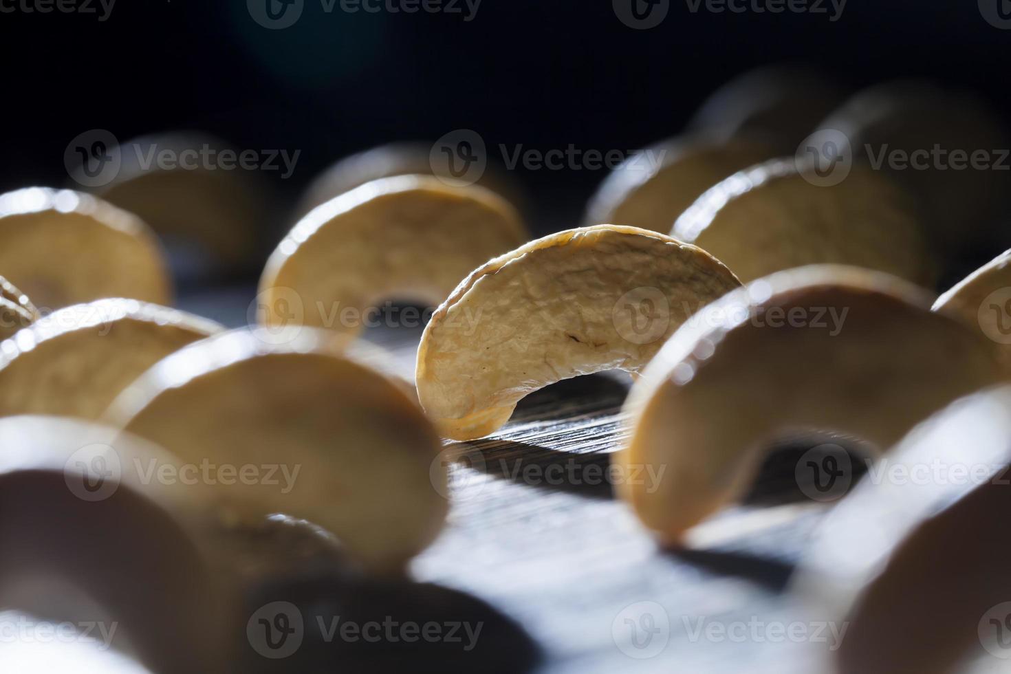 dried cashew nuts on a wooden table photo