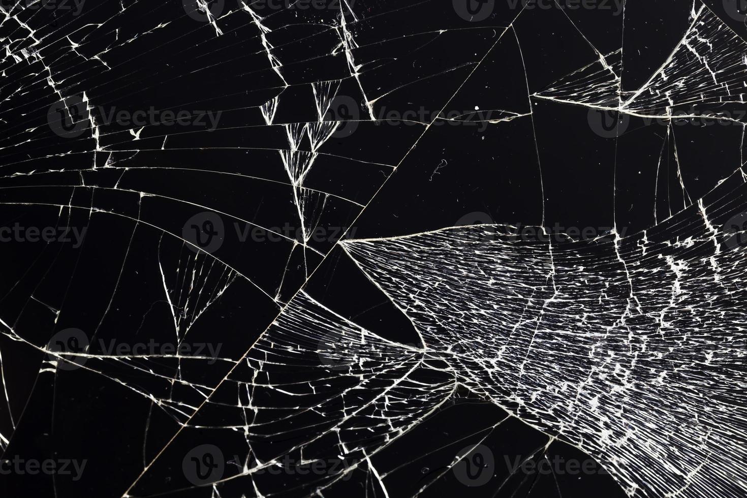 broken thin glass with lots of cracks photo