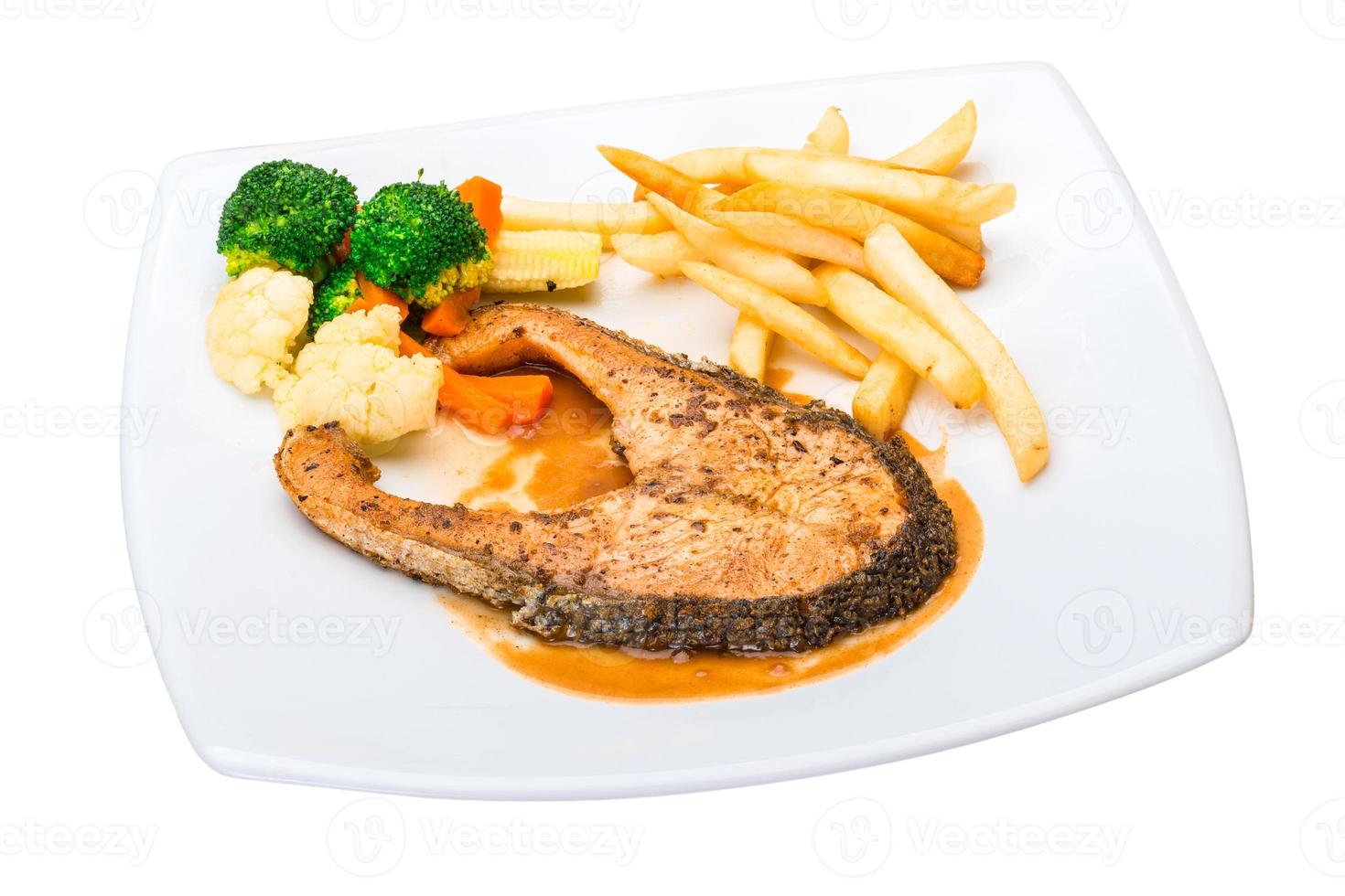 Salmon steak on the plate and white background photo