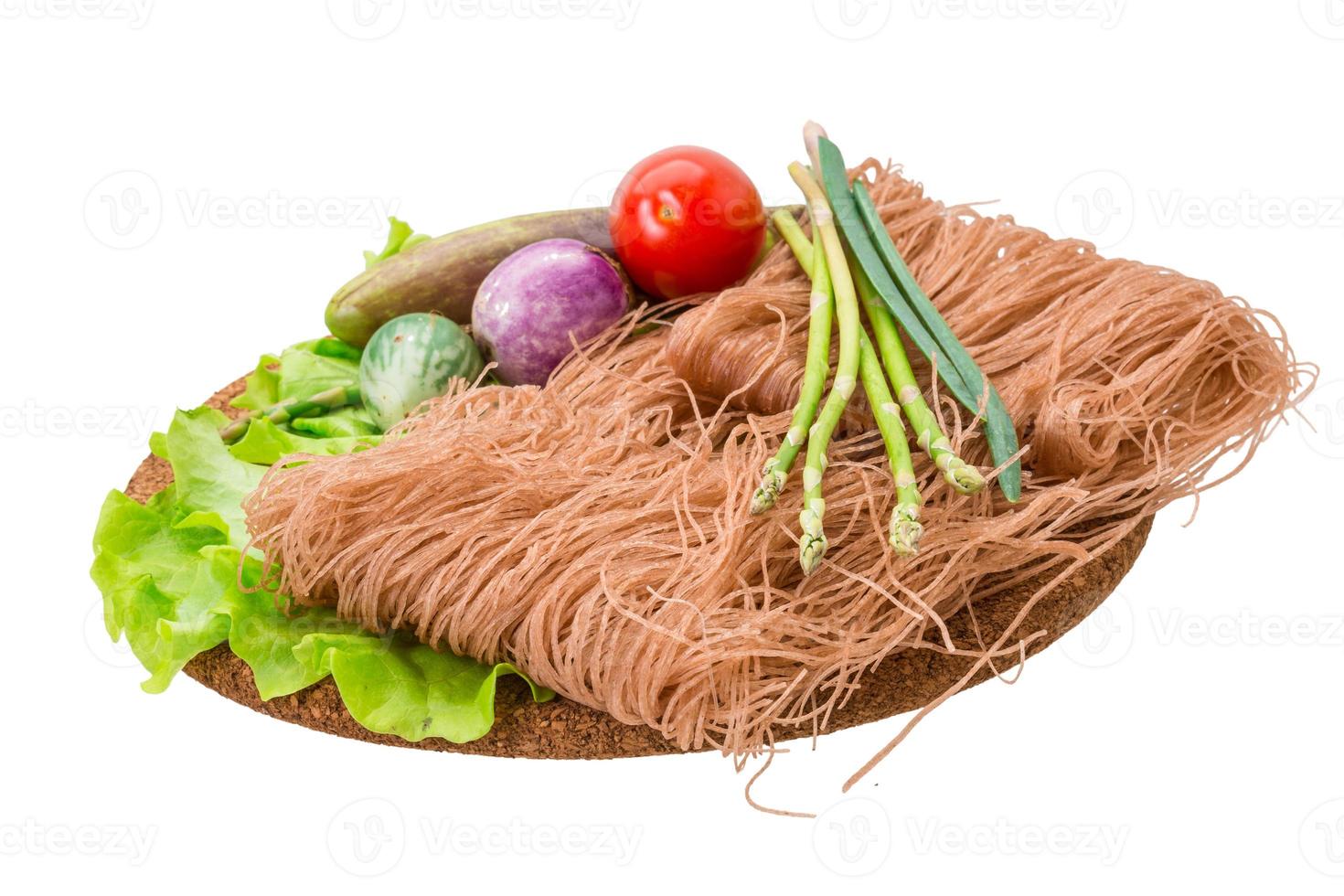 Raw rice noodles on white background photo