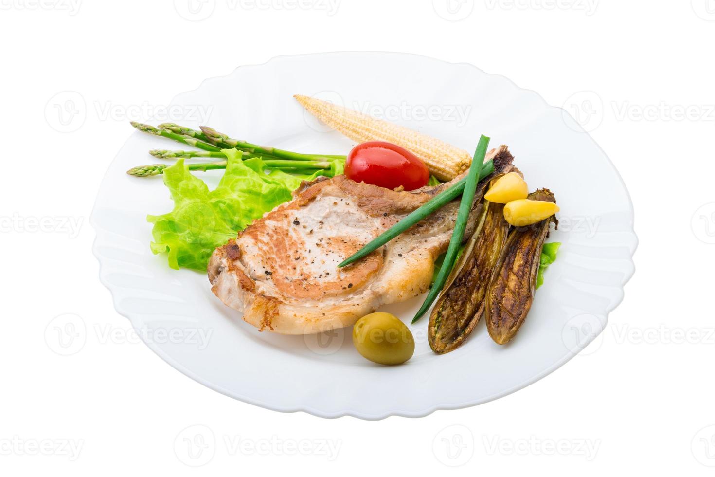 T-bone steak on the plate and white background photo