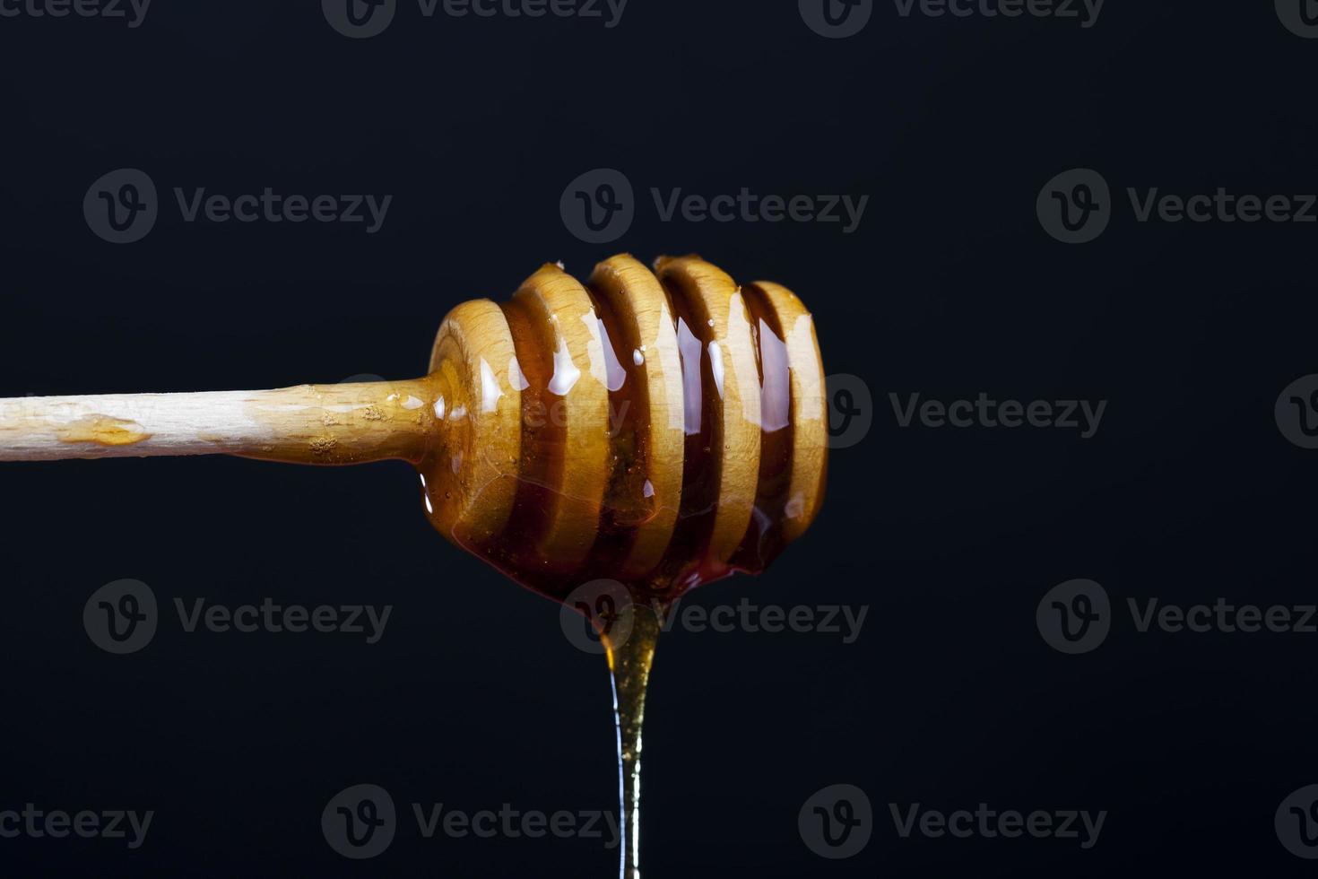Miel dulce espesa y deliciosa actual, de cerca foto
