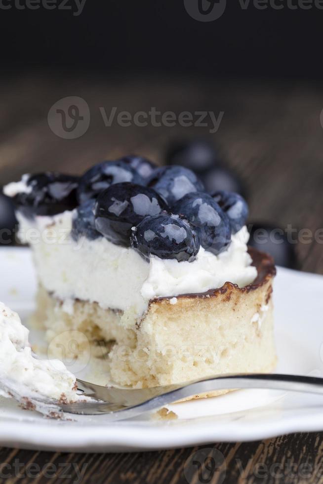 tartlet with chocolate and buttercream with blueberries photo