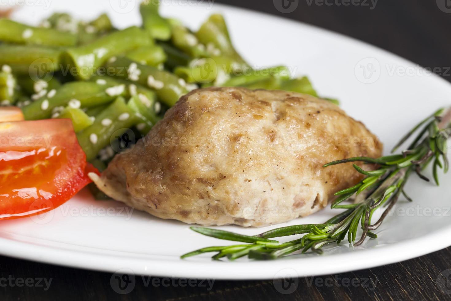 baked asparagus beans with sesame seeds and meat cutlet photo