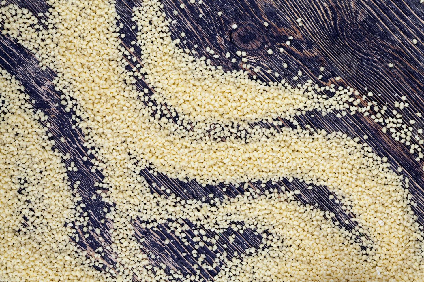 yellow dry crushed couscous is a traditional food for Africa photo