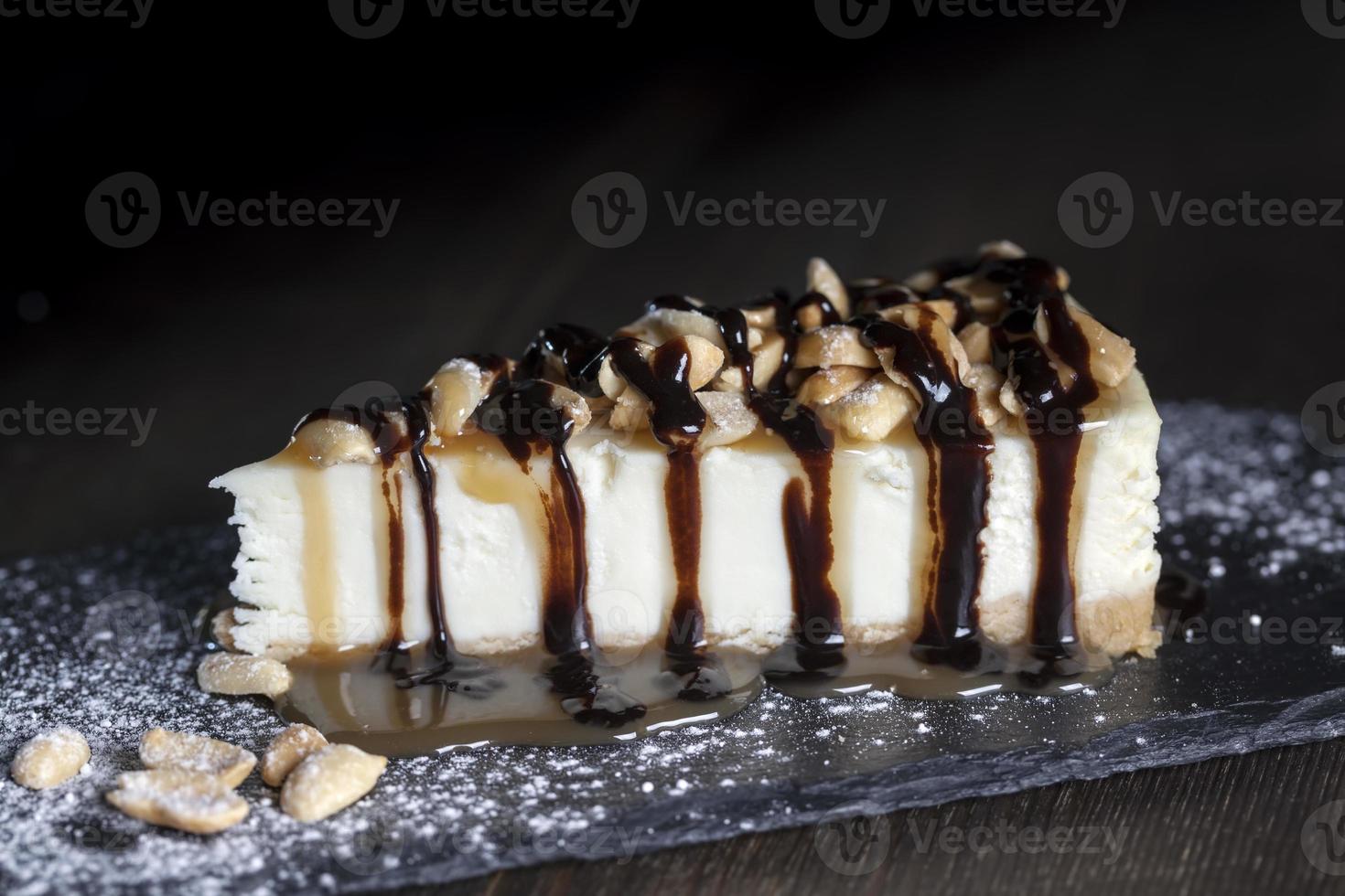 dessert cheesecake covered with caramel and chocolate photo