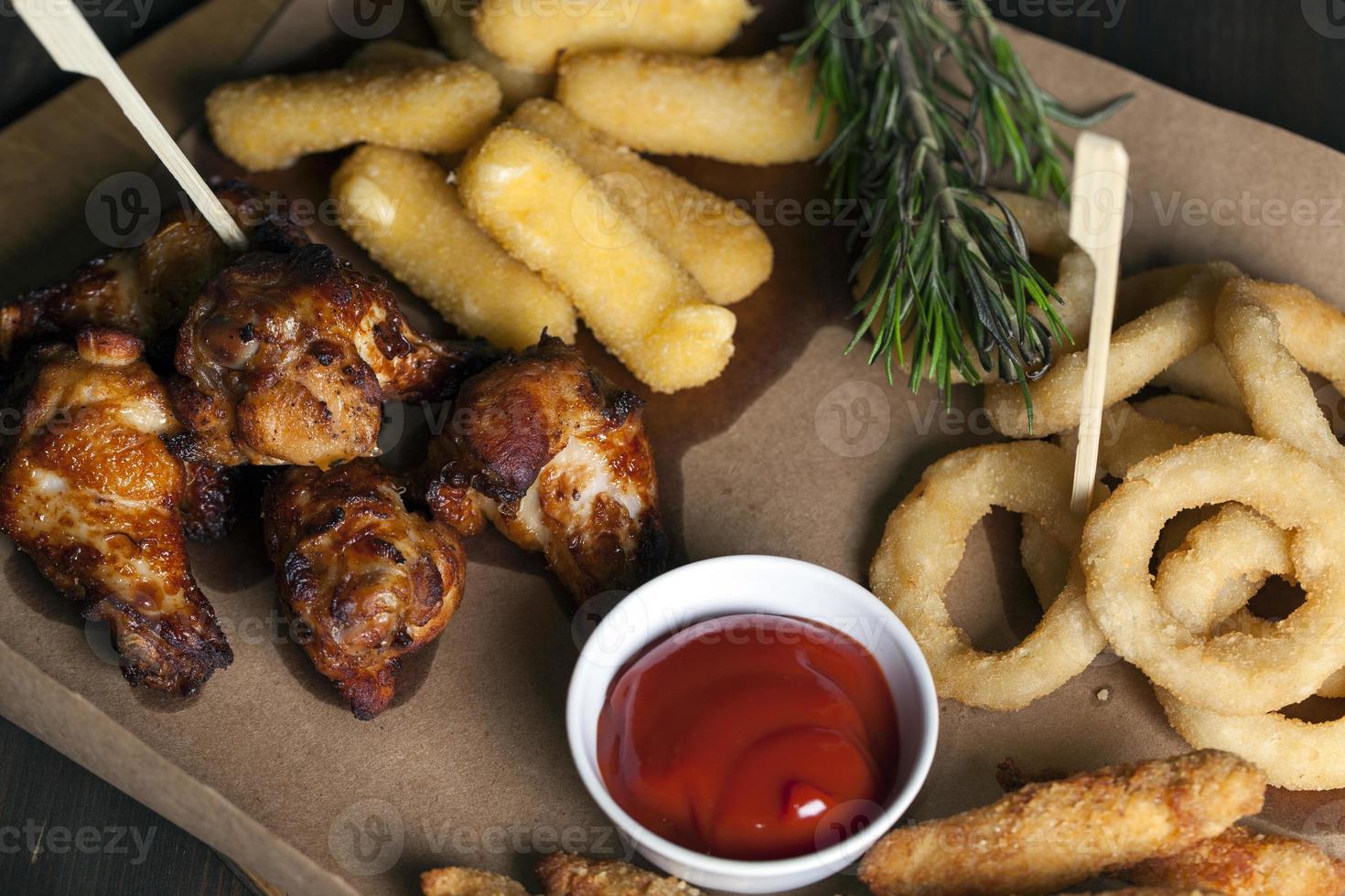 baked chicken wings together with ketchup photo