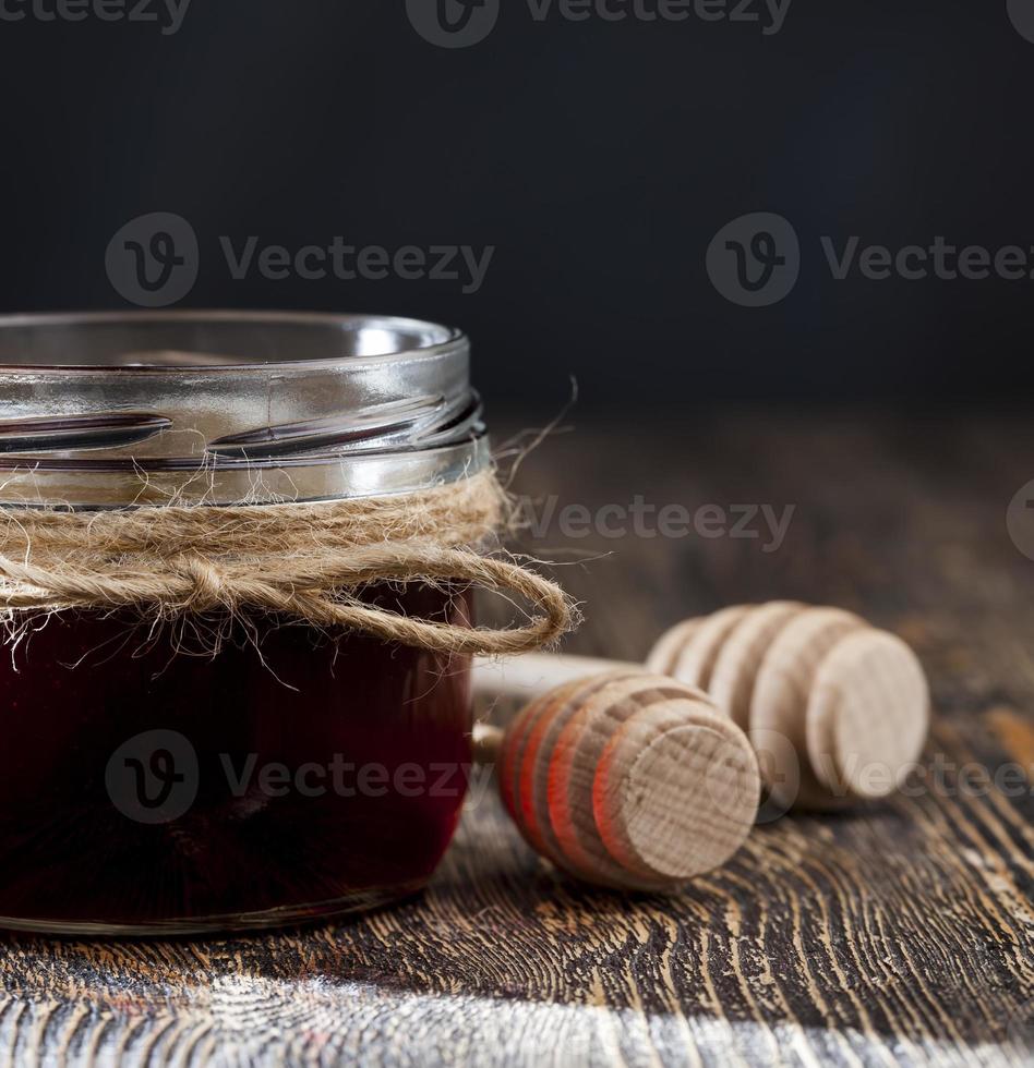 natural viscous honey, which is produced by honey bees photo