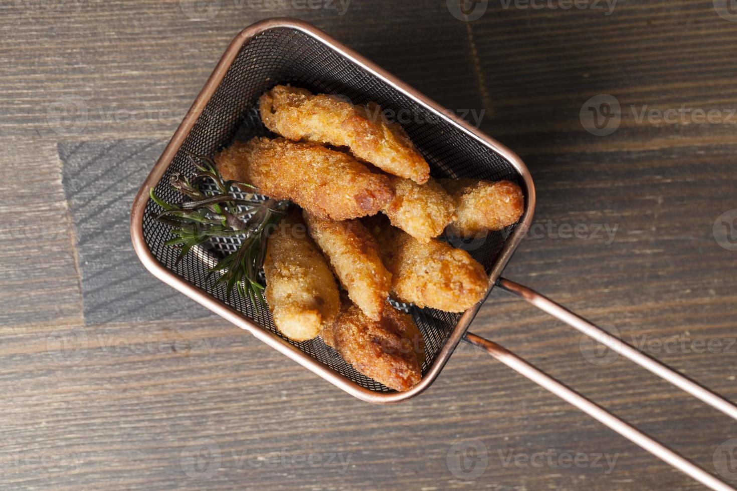 deep fried chicken pieces cut into long pieces photo