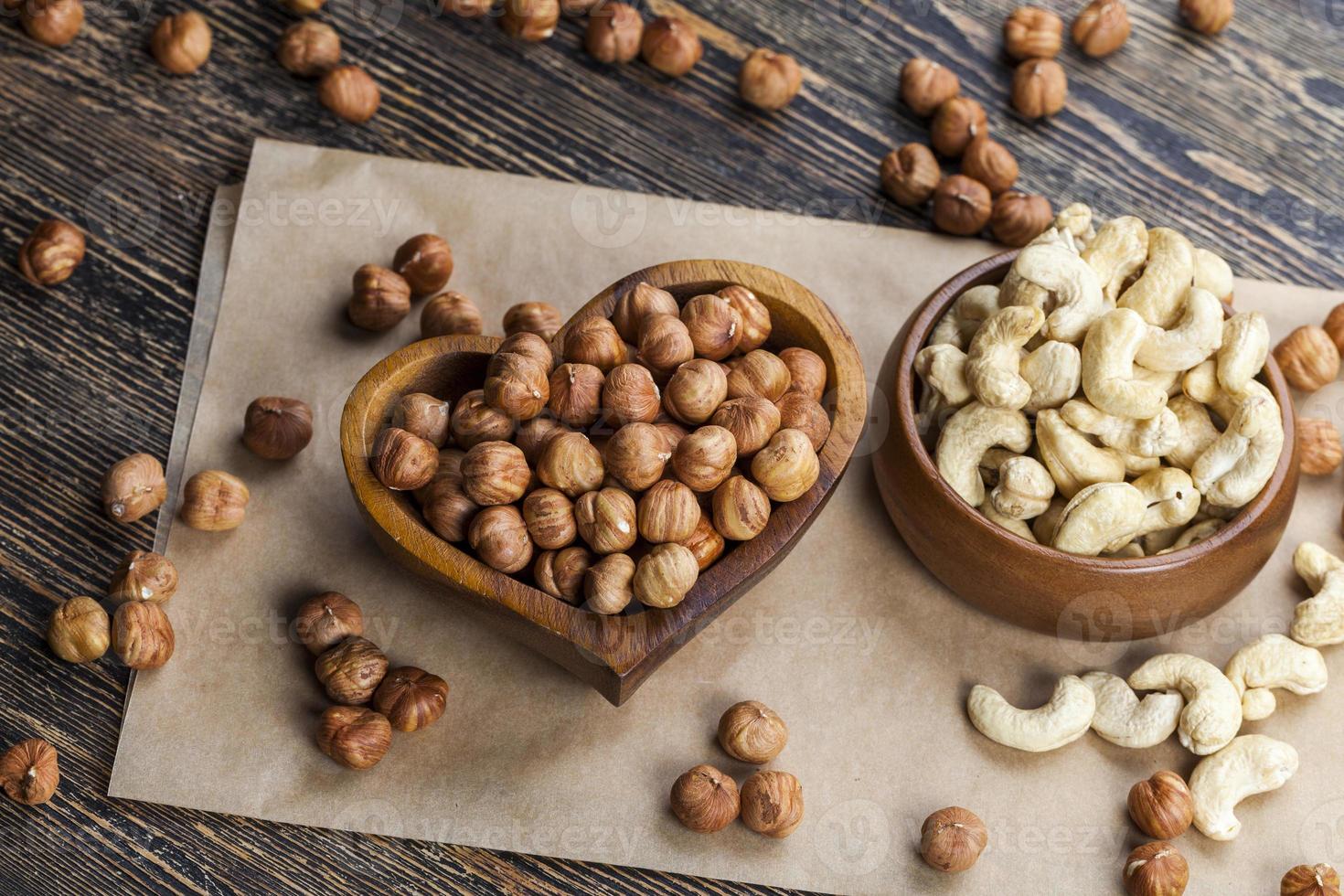 dried cashew nuts on a wooden table photo