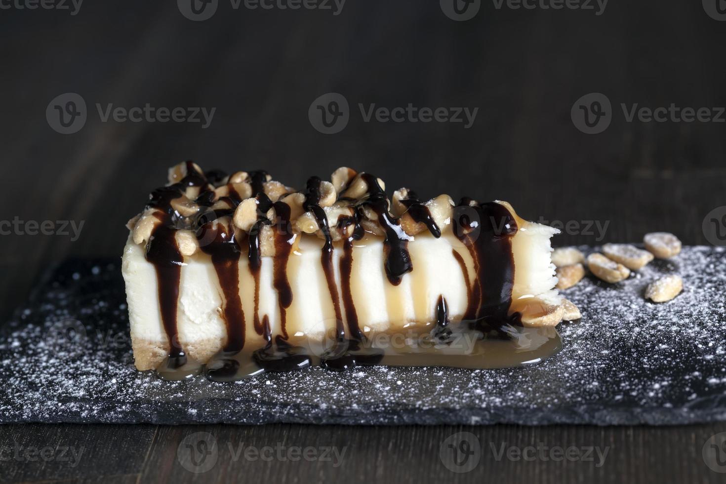 dessert cheesecake covered with caramel and chocolate photo