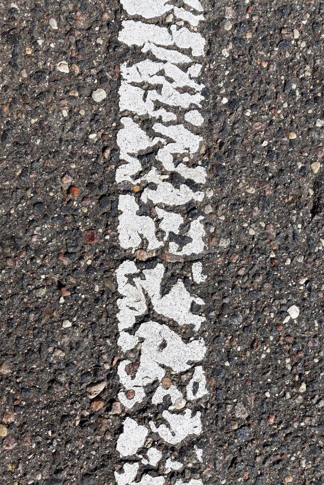 paved road with white road markings photo