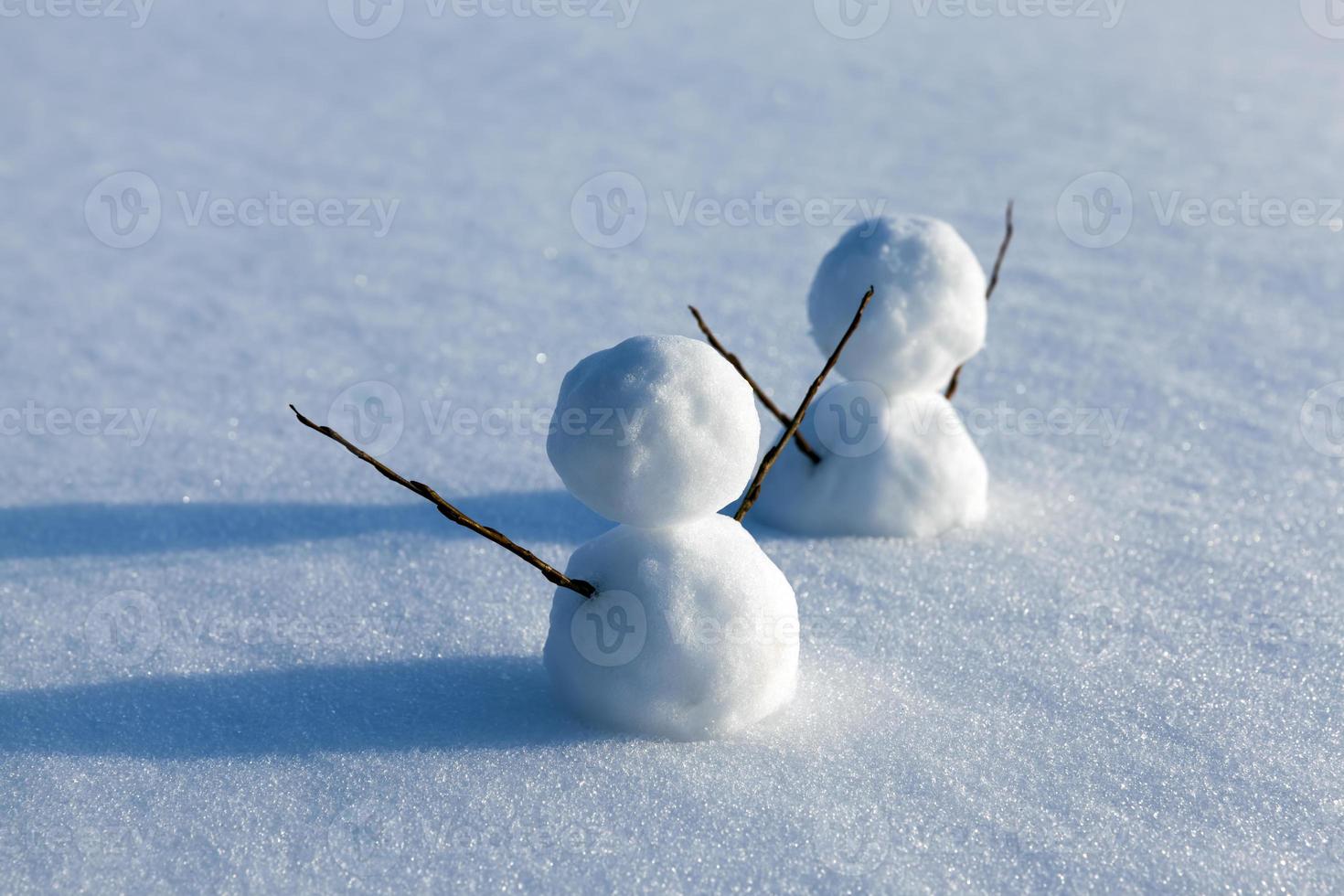 snowmen made of snow in winter photo