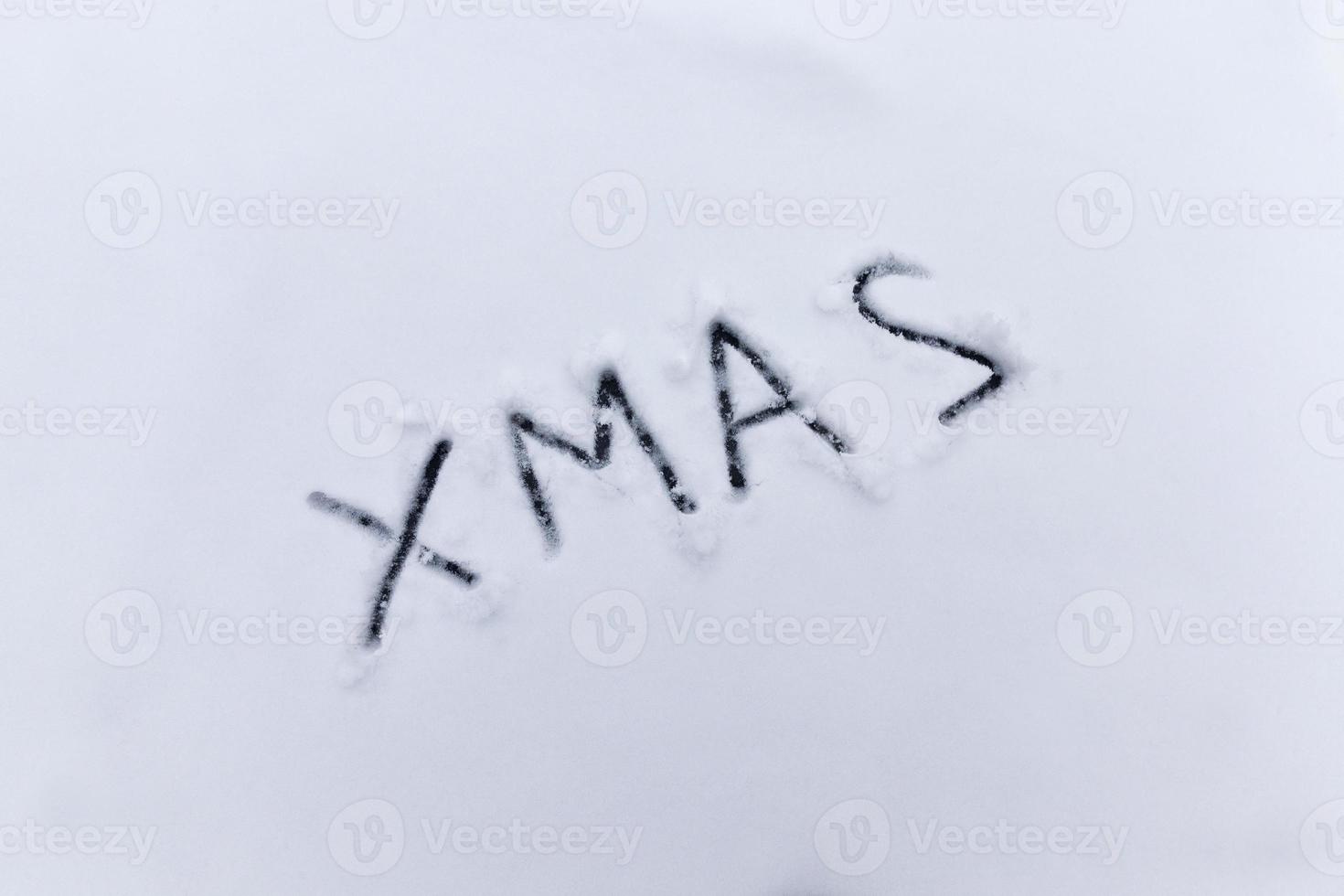 words xmas painted on snow photo
