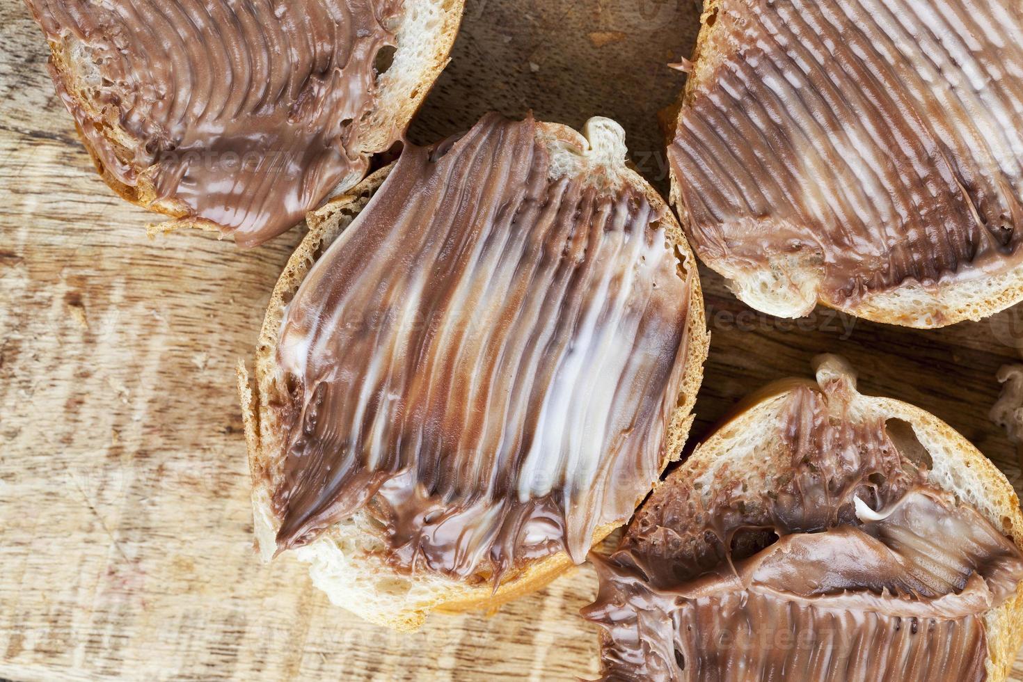 natural cocoa chocolate paste during Breakfast with baguette photo