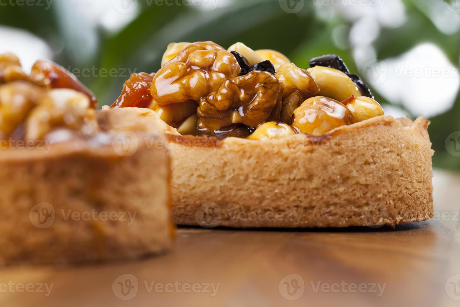 nut tartlet covered with a layer of liquid caramel photo