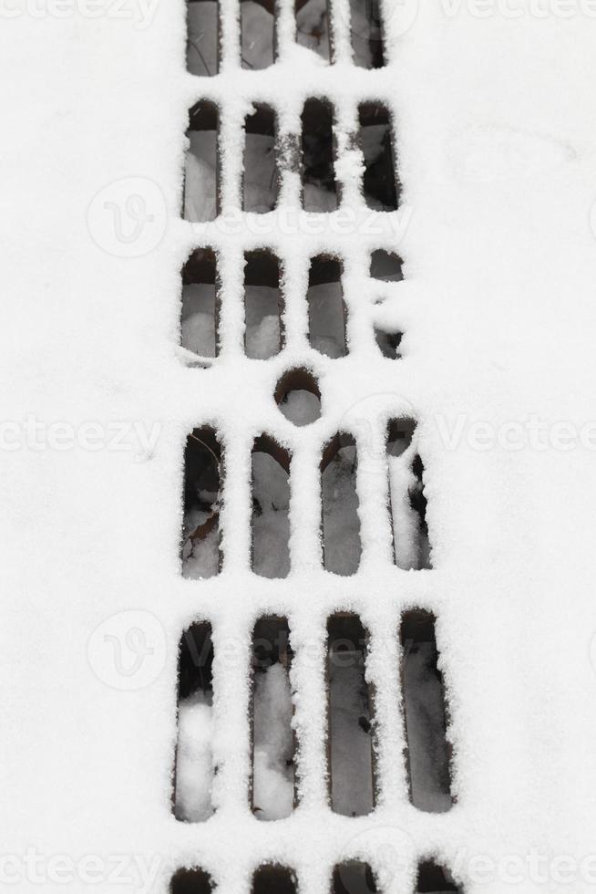 Grate under the snow photo