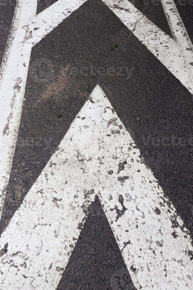 paved road with white road markings photo